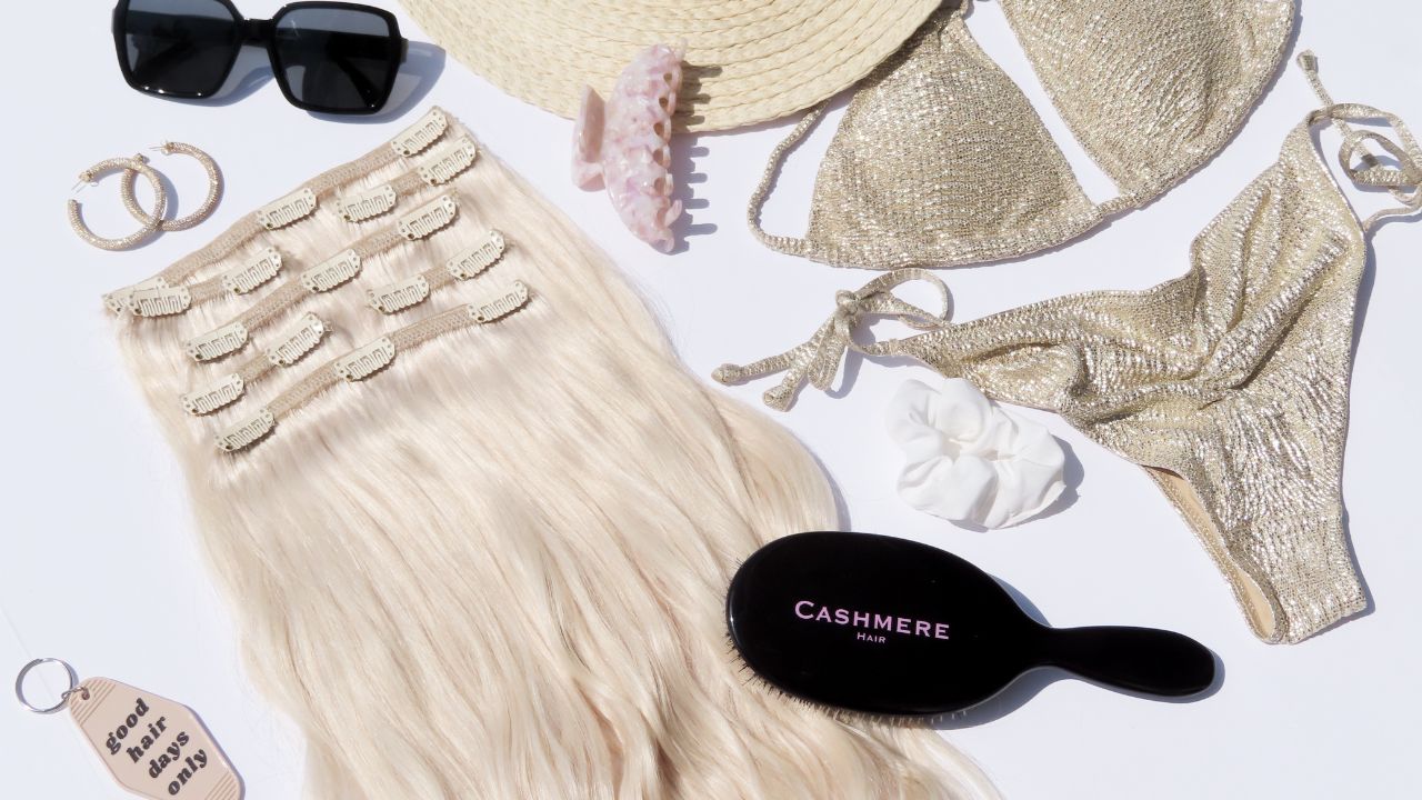 summer themed flatlay with cashmere hair